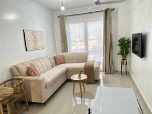 a living room with a couch and a table at The KONGONI PLACE in Gatunga