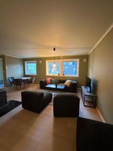 a living room with a couch and a table at Leilighet nært sentrum in Stryn