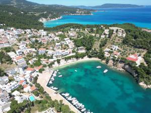 an aerial view of a beach with boats in the water at Magdalini in Votsi