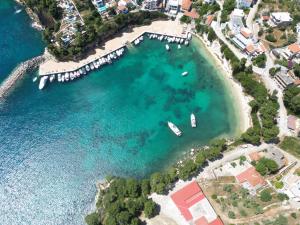 an aerial view of a harbor with boats in the water at Magdalini in Votsi