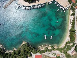 an aerial view of a harbor with boats in the water at Magdalini in Votsi