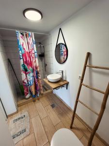 a bathroom with a sink and a mirror at Summer Home Corbu in Corbu +41 photos