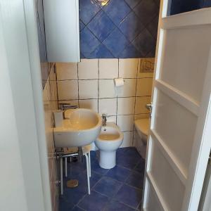 a small bathroom with a sink and a toilet at Casa Pappalardo in Ravello