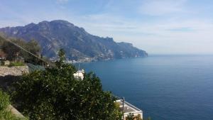 a view of a large body of water with a mountain at Casa Pappalardo in Ravello