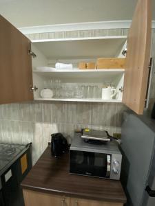 Kuchyň nebo kuchyňský kout v ubytování Departamento 3 domitorios, a dos cuadras de Espacio Urbano, Terminal de Buses y Sodimac + 8 fotografií