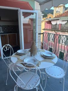 Balkón nebo terasa v ubytování HH Moneglia la Piazzetta L' Attico + 23 fotografií