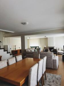 a living room with a wooden table and chairs at Casa Machado in Montalegre