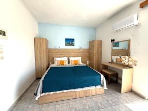Postel nebo postele na pokoji v ubytování Sotirakis Hotel