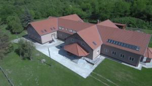 an overhead view of a large house with red roofs at Ízisz Apartman in Mátraterenye