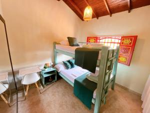 Postelja oz. postelje v sobi nastanitve Blomst Casa Hostal