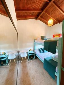 Postelja oz. postelje v sobi nastanitve Blomst Casa Hostal