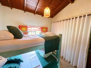 Postelja oz. postelje v sobi nastanitve Blomst Casa Hostal
