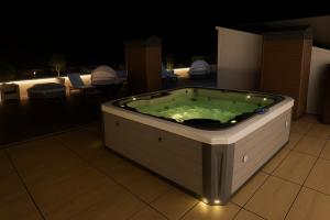 a jacuzzi tub sitting on top of a building at Biser Igala in Herceg-Novi