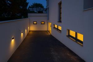 a hallway of a building at night with lights at Biser Igala in Herceg-Novi