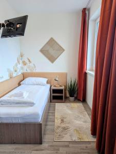 Postel nebo postele na pokoji v ubytování Aparthotel Neudörfl
