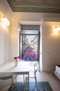 a room with a table and a view of a building at Principe del Pardo in Catania