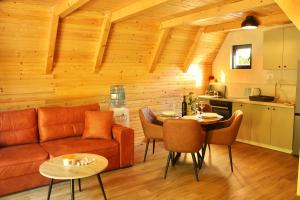 a living room with a couch and a table at Trebižat Oasis in Čapljina