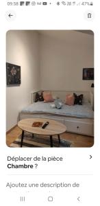 a room with a bed and a coffee table at Echarvines in Talloires