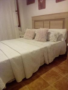 Postel nebo postele na pokoji v ubytování habitacion compartida con anfitrión