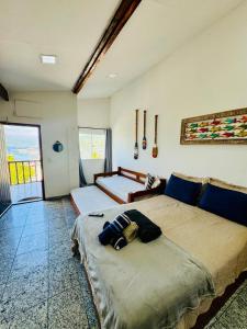a bedroom with two beds in a room at Vista mar 1 in Arraial do Cabo