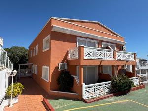 a brown building with a balcony at Nature Somhome Peñíscola in Peñíscola