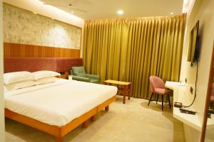 Postel nebo postele na pokoji v ubytování Hotel Surguru