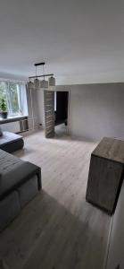 a living room with a couch and a table at Pernavas street in Rīga