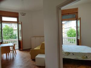 Ένα ή περισσότερα κρεβάτια σε δωμάτιο στο Triestecenter Rooms & Apartments - Colori di Trieste
