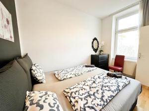 Postel nebo postele na pokoji v ubytování Cozy Rooms in Brigittenau Area MM29