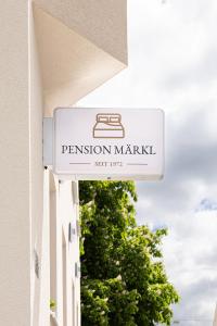 a sign for a fashion market on the side of a building at Pension Märkl Augsburg in Augsburg