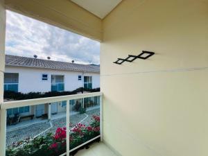 a balcony with a view of a building at Casa Condomínio Juquehy 100 M do Centrinho in Juquei +32 photos
