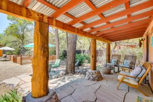 an outdoor patio with a wooden pergola at Casita Colibri Lovely, Romantic Patagonia Retreat in Patagonia +17 photos