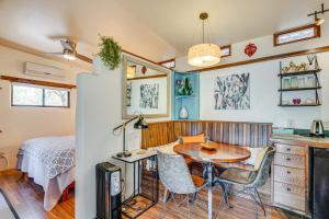 a kitchen and dining room with a table and chairs at Casita Colibri Lovely, Romantic Patagonia Retreat in Patagonia