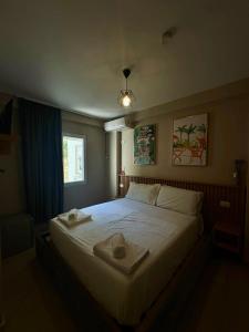 Voodi või voodid majutusasutuse CoastAL Hotel Shengjin toas