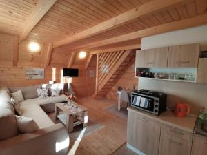 a living room with a couch and a table at Brvnara N&N in Laktaši
