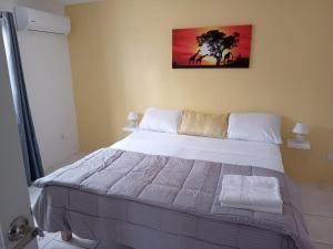 Postel nebo postele na pokoji v ubytování High View Apartments C