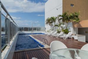 a swimming pool on the roof of a building at Blue Tree Premium Manaus in Manaus