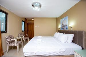 Postel nebo postele na pokoji v ubytování New Hotel Kuč By Marvel