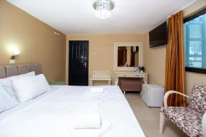 Postel nebo postele na pokoji v ubytování New Hotel Kuč By Marvel