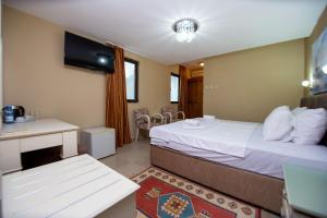 Postel nebo postele na pokoji v ubytování New Hotel Kuč By Marvel