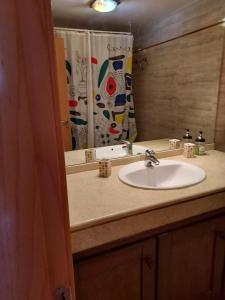 Ένα μπάνιο στο Apartamento Poseidon