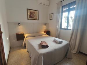 Postel nebo postele na pokoji v ubytování El Rancho Grande - Apartamento