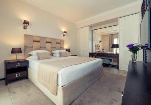 Postel nebo postele na pokoji v ubytování Hotel Moskva