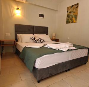 Postel nebo postele na pokoji v ubytování Nava Apartments
