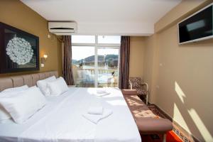 Postel nebo postele na pokoji v ubytování New Hotel Kuč By Marvel