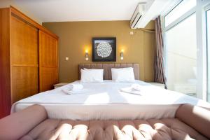 Postel nebo postele na pokoji v ubytování New Hotel Kuč By Marvel