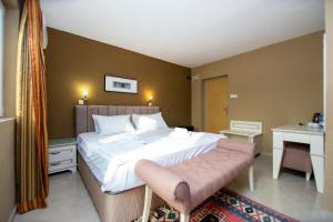Postel nebo postele na pokoji v ubytování New Hotel Kuč By Marvel