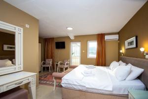 Postel nebo postele na pokoji v ubytování New Hotel Kuč By Marvel