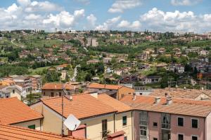 a view of a town with houses and roofs at KM30rooms in Campobasso