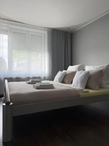 Postel nebo postele na pokoji v ubytování GM Home + 8 fotografií